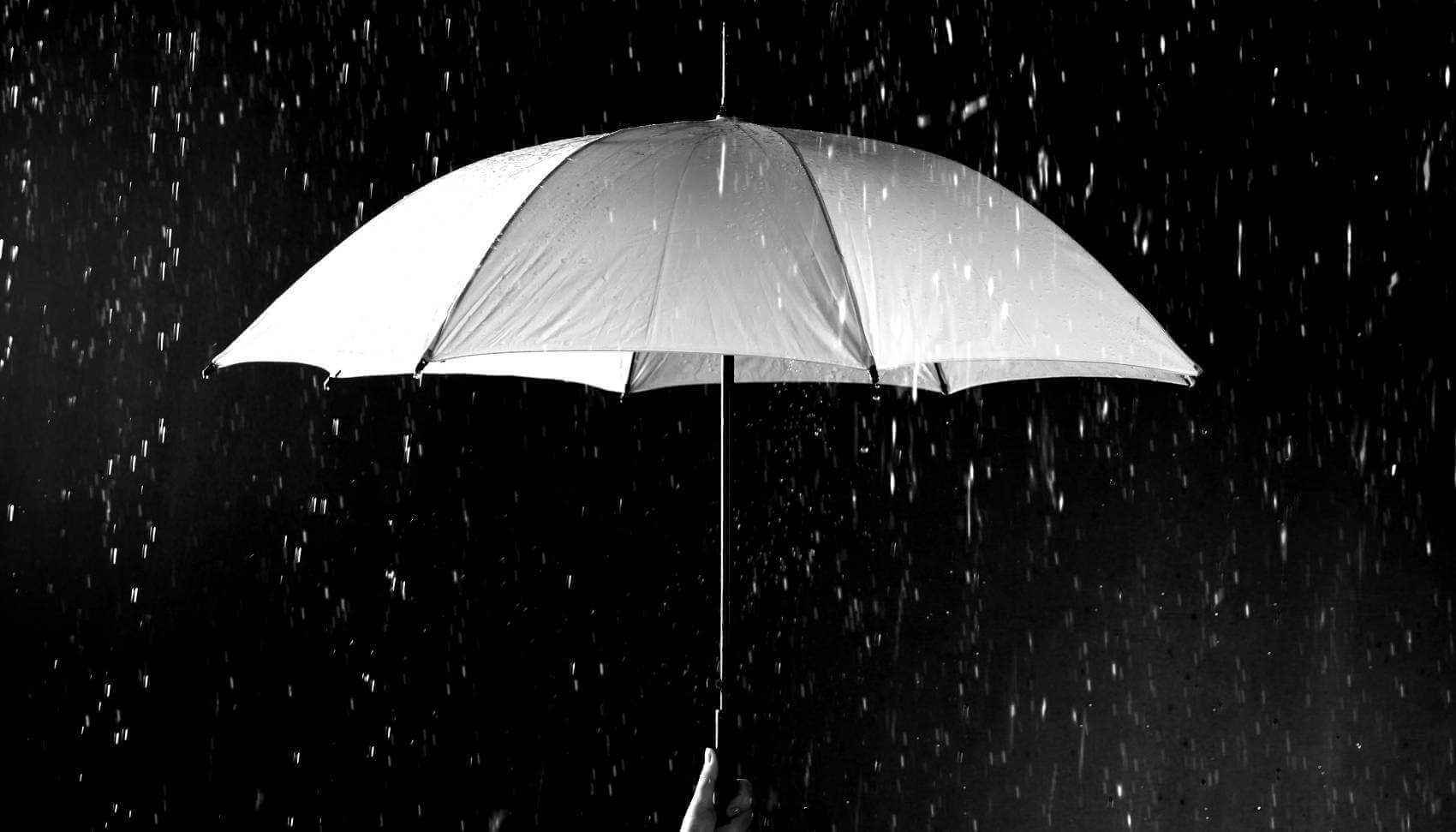 Image of umbrella in the rain.