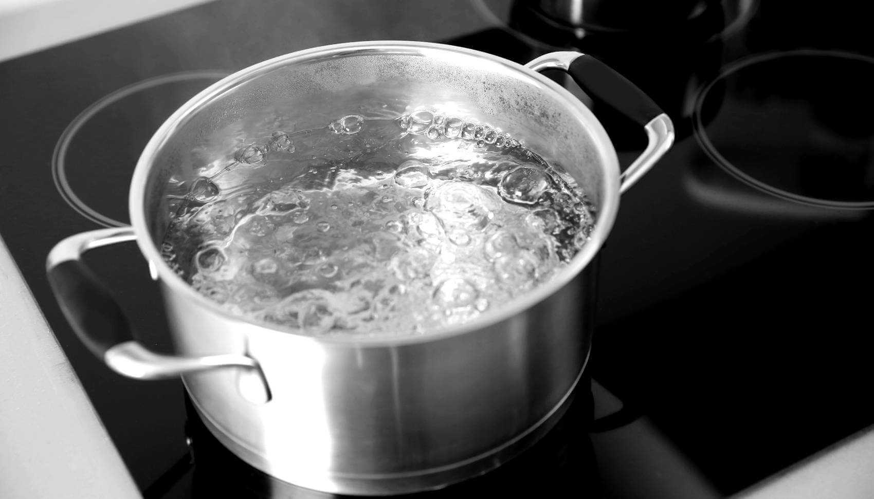Boiling water in pot on stove top