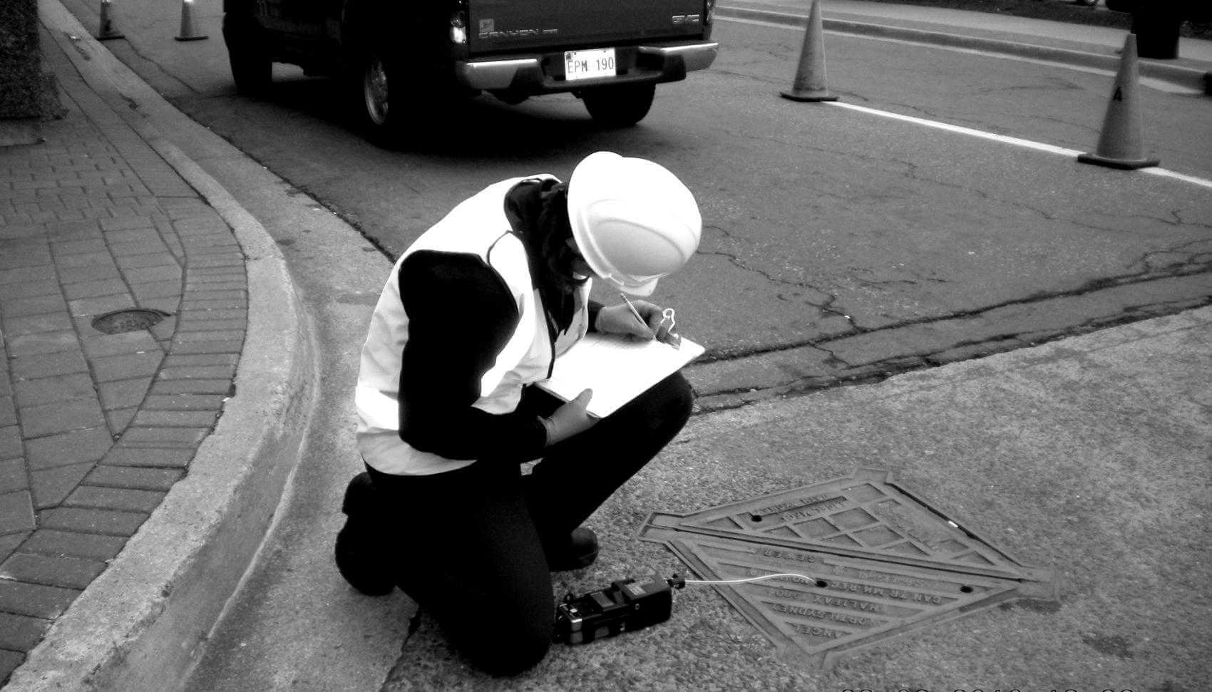 Halifax Water employee performing manhole gas monitoring