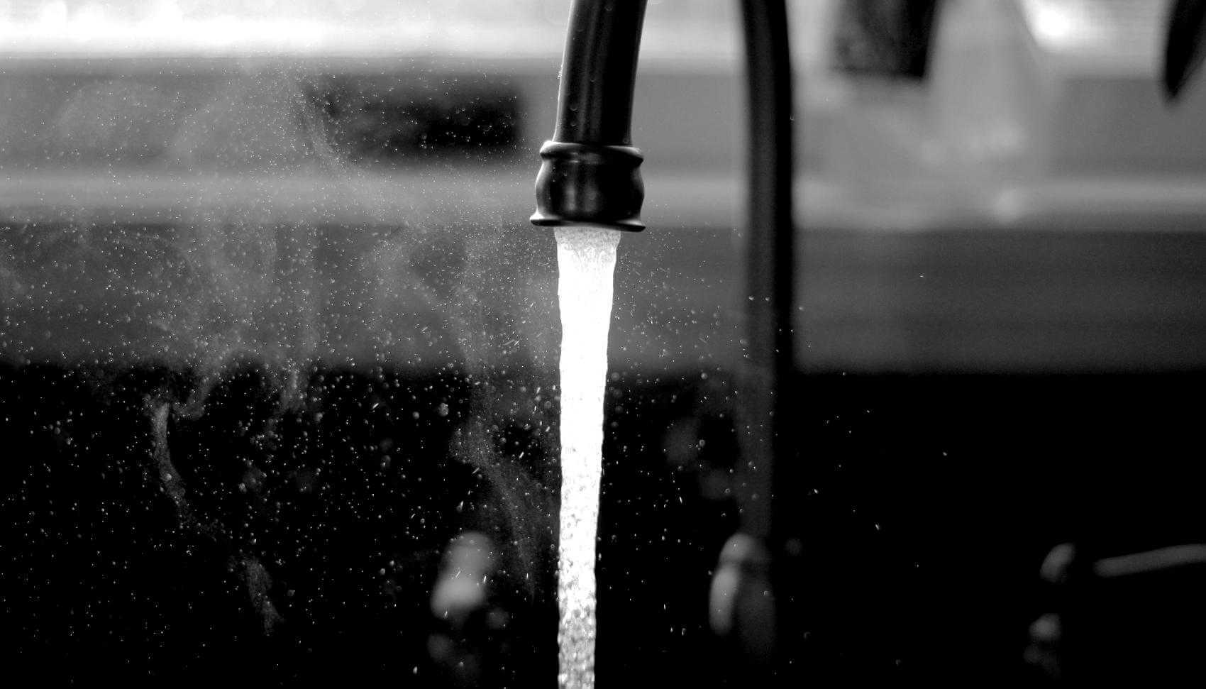 Photo of water flowing from a tap