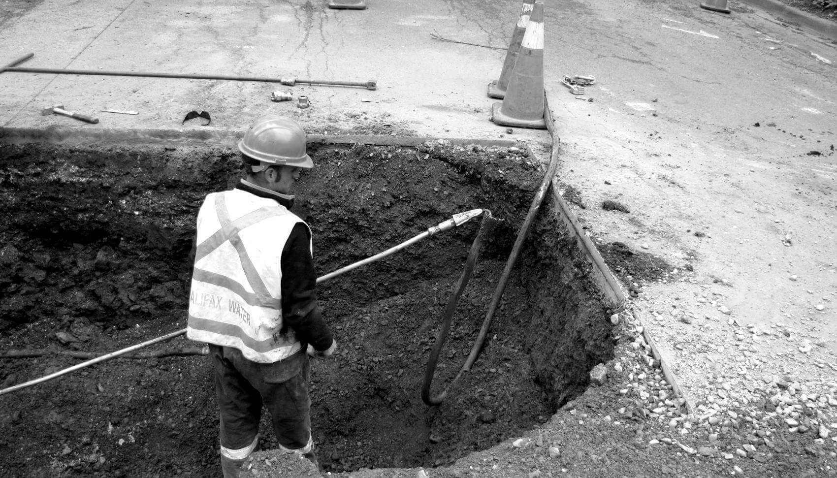 Halifax Water employee replacing a lead pipe