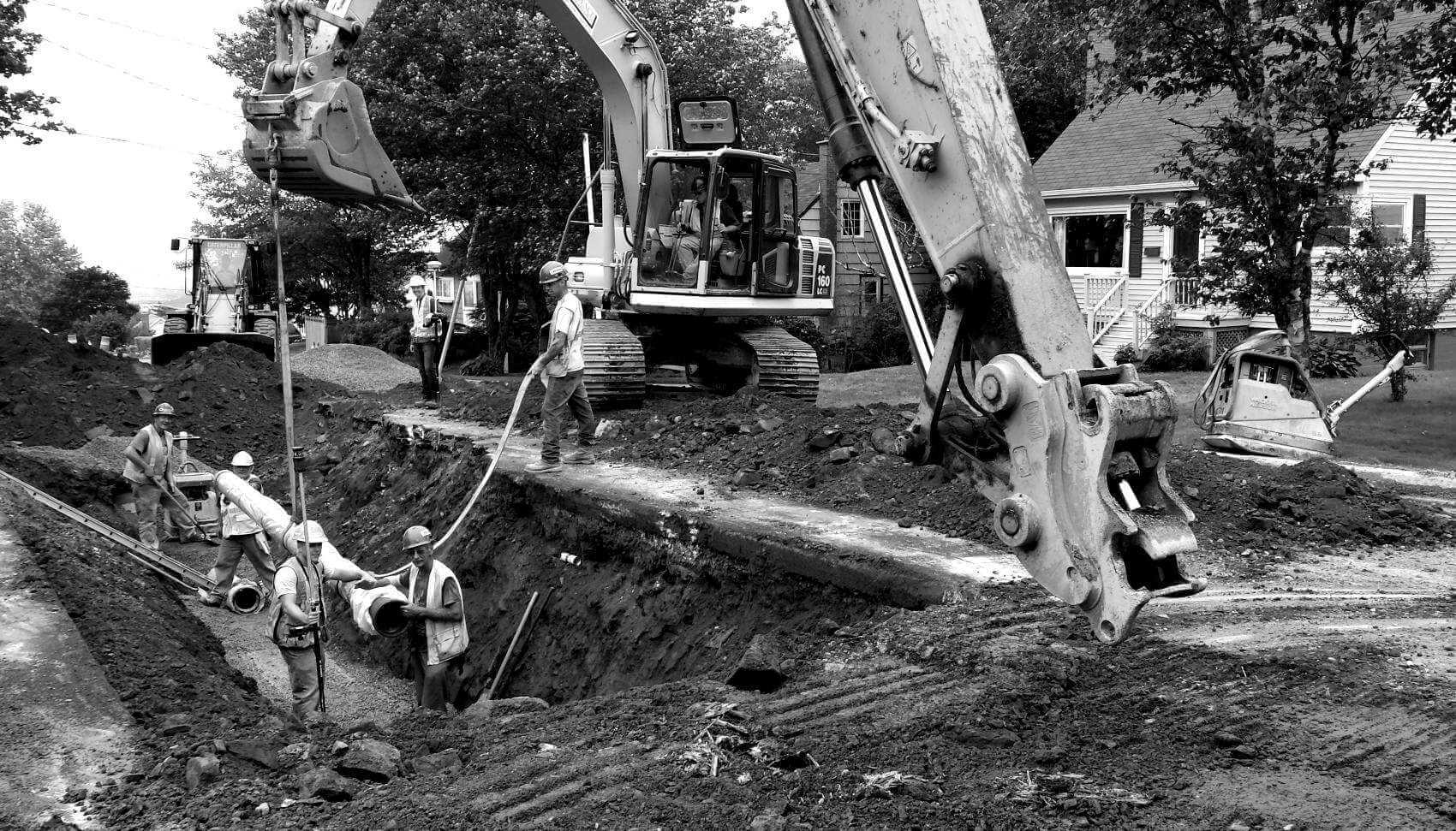 Halifax Water contractors and machinery laying pipe underground