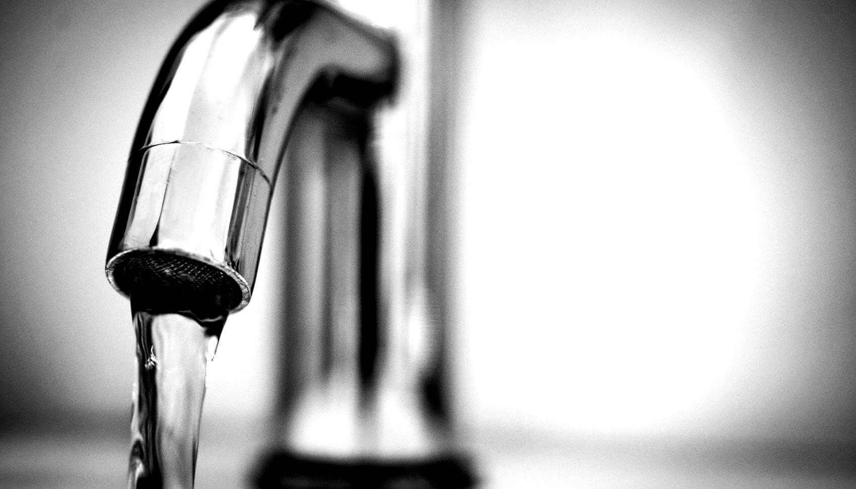 Picture of a water faucet with water pouring out