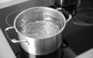 Boiling water in pot on stove top