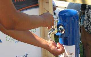 a portable Halifax Water tap being used to wash hands