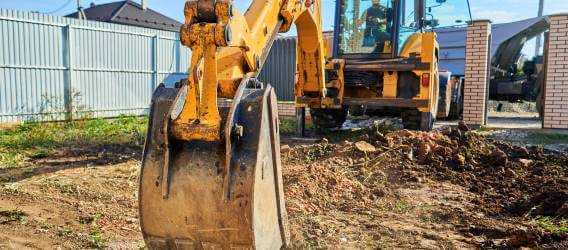 Banner Image - Get the Lead Out - Excavator Digging a Service - AdobeStock_384691445